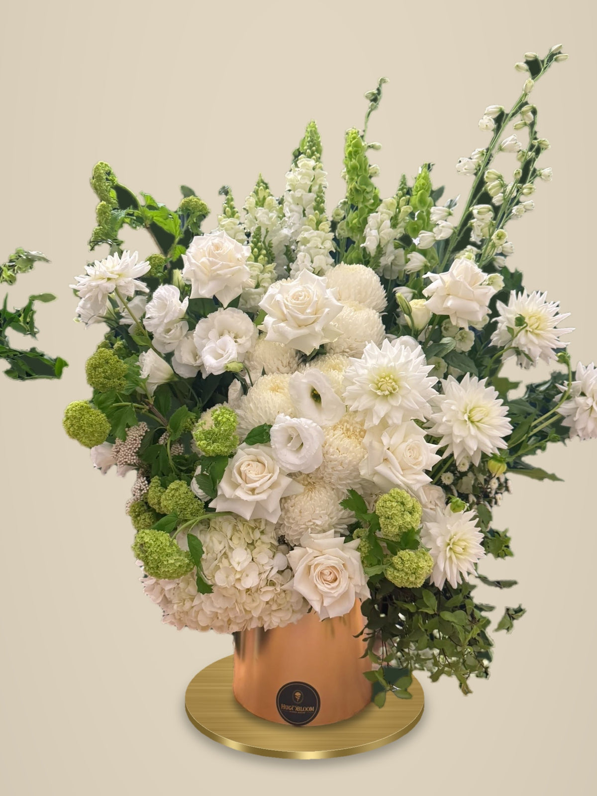 Large white arrangement in a gold vessel for private events by Hugobloom
